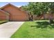 Charming home featuring a two-car garage, landscaped lawn, and mature tree at 16052 Deer Ridge Dr # B, Morrison, CO 80465