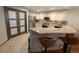 Bright kitchen with granite countertops, stainless steel appliances, and a breakfast bar with barstool seating at 16052 Deer Ridge Dr # B, Morrison, CO 80465
