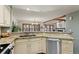 Bright kitchen with granite countertops, stainless steel appliances, and plenty of cabinet space at 16052 Deer Ridge Dr # B, Morrison, CO 80465