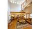 Spacious living room and open floorplan with hardwood floors and comfortable leather seating at 16052 Deer Ridge Dr # B, Morrison, CO 80465