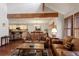 Spacious living room with open floorplan with hardwood floors and comfortable leather seating at 16052 Deer Ridge Dr # B, Morrison, CO 80465