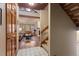 Living room with brick fireplace, vaulted ceilings, exposed beams, hardwood floors and comfortable furniture at 16052 Deer Ridge Dr # B, Morrison, CO 80465