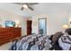 Comfortable main bedroom with a wooden dresser and a television, and a bathroom in the background at 16052 Deer Ridge Dr # B, Morrison, CO 80465