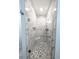 Bright shower with a sleek glass door, bench, and stunning white tile at 16052 Deer Ridge Dr # B, Morrison, CO 80465