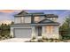 Two-story home with gray siding, stone accents, and a two-car garage at 4304 Ridgewalk Pt, Castle Rock, CO 80108