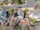 This home features an aerial view showcasing solar panels, a well-maintained backyard, and neighborhood surroundings at 6868 Johnson St, Arvada, CO 80004