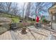 Backyard deck featuring a firepit, seating area, and hammock, perfect for relaxing and entertaining at 6868 Johnson St, Arvada, CO 80004