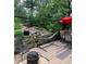 An inviting backyard deck offers relaxation with hammock, outdoor seating, and a tranquil water feature at 6868 Johnson St, Arvada, CO 80004