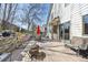 Backyard with a wooden deck, fire pit, seating area and tiered landscaping, perfect for outdoor enjoyment at 6868 Johnson St, Arvada, CO 80004