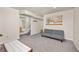 Spacious basement with living area, carpet, and access to a kitchen area at 6868 Johnson St, Arvada, CO 80004
