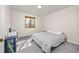 Bedroom with gray carpet and basic furnishings at 6868 Johnson St, Arvada, CO 80004