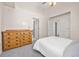 Bedroom with vaulted ceiling, dresser and gray carpet at 6868 Johnson St, Arvada, CO 80004