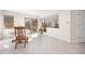 Bright dining area with tile floors, sliding glass doors, and backyard access at 6868 Johnson St, Arvada, CO 80004
