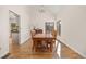 Bright dining room featuring hardwood floors and plenty of natural light at 6868 Johnson St, Arvada, CO 80004