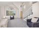 Bright living room with vaulted ceilings, large windows, and a staircase, providing ample natural light and space at 6868 Johnson St, Arvada, CO 80004
