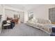 Cozy living room with carpet, dining room view, and bright windows at 6868 Johnson St, Arvada, CO 80004