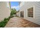 Spacious backyard featuring a wood deck with access to home, landscaped plants, and a well-maintained fence at 5107 Pasadena Way, Broomfield, CO 80023