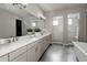 Luxurious bathroom with double vanity, soaking tub, walk-in shower, and elegant finishes for a spa-like experience at 8110 S Kellerman Cir, Aurora, CO 80016