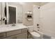 Bright bathroom with white subway tile and vanity with quartz countertop at 8110 S Kellerman Cir, Aurora, CO 80016