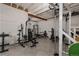 Exercise room with weights and exercise equipment for a home gym at 8110 S Kellerman Cir, Aurora, CO 80016