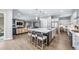 Spacious kitchen featuring a large island, modern appliances, and an open layout at 8110 S Kellerman Cir, Aurora, CO 80016