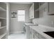 Bright laundry room with modern washer, dryer, and ample counter space at 8110 S Kellerman Cir, Aurora, CO 80016