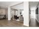 Bright, open-concept living room with hardwood floors and modern decor for comfortable living at 8110 S Kellerman Cir, Aurora, CO 80016