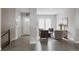 Bright living room features an open layout with hardwood floors, neutral walls, and comfortable seating at 8110 S Kellerman Cir, Aurora, CO 80016