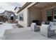 Charming covered patio with comfortable seating, a barbecue grill, and stylish string lights at 8110 S Kellerman Cir, Aurora, CO 80016