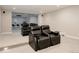 Theater seats on raised platform offer spacious and comfortable seating at 8110 S Kellerman Cir, Aurora, CO 80016