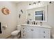Bright bathroom boasts a modern vanity, quartz countertop, updated fixtures, and a clean design at 48 Galapago St, Denver, CO 80223