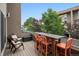 Enjoy outdoor dining on this spacious deck with comfortable seating and neighborhood views at 48 Galapago St, Denver, CO 80223