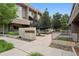 Exterior view of modern condos with landscaped courtyard and walkways at 48 Galapago St, Denver, CO 80223