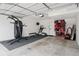 Spacious garage featuring workout equipment, storage, and a bright, functional layout at 48 Galapago St, Denver, CO 80223