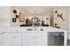 Modern kitchen with quartz countertops and stainless steel appliances, overlooking the living and dining area at 48 Galapago St, Denver, CO 80223
