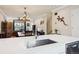 View of the living area, kitchen, and dining area, with luxury vinyl plank flooring throughout at 48 Galapago St, Denver, CO 80223