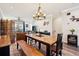 Open-concept living space offering access to balcony and views of dining and kitchen at 48 Galapago St, Denver, CO 80223