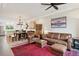 Open-concept living space with hardwood floors that connects the kitchen, dining, and living areas at 48 Galapago St, Denver, CO 80223