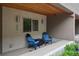 Cozy patio with chairs and table, creating an inviting outdoor space at 48 Galapago St, Denver, CO 80223