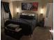 Inviting bedroom with neutral walls, decorative wall sconces, and a cozy seating area at 6711 S Ivy Way # B5, Centennial, CO 80112