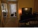 Cozy bedroom featuring mirrored closet doors and a hallway leading to a bathroom at 6711 S Ivy Way # B5, Centennial, CO 80112