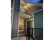 Charming exterior view showcasing gray siding, a balcony, and an inviting entrance at 6711 S Ivy Way # B5, Centennial, CO 80112