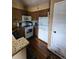 Charming kitchen showcasing updated appliances and warm wood flooring at 6711 S Ivy Way # B5, Centennial, CO 80112