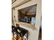 Open-concept kitchen featuring a breakfast bar with granite countertops at 6711 S Ivy Way # B5, Centennial, CO 80112