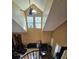 Spacious living room with a high ceiling, fireplace, and large windows for natural light at 6711 S Ivy Way # B5, Centennial, CO 80112