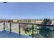Balcony view of lush greenery and distant buildings, offering a serene outdoor space at 5455 Landmark Pl # 407, Greenwood Village, CO 80111