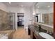 Modern bathroom featuring a glass shower, soaking tub, and double vanity with granite countertop at 5455 Landmark Pl # 407, Greenwood Village, CO 80111