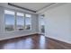 Bright bedroom with hardwood floors and large windows showcasing breathtaking mountain views at 5455 Landmark Pl # 407, Greenwood Village, CO 80111