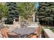 Relaxing courtyard with stone fountain, lush landscaping, and cozy seating area for residents to enjoy at 5455 Landmark Pl # 407, Greenwood Village, CO 80111