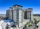 Multi-story apartment building featuring balconies, scenic views, and modern architecture at 5455 Landmark Pl # 407, Greenwood Village, CO 80111